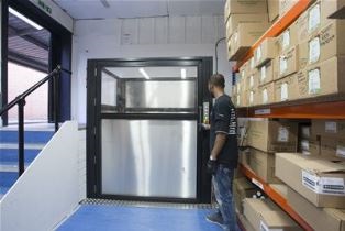 Stannah Levelmaster low-rise platform goods lift – solving stock flow in a split-level storeroom